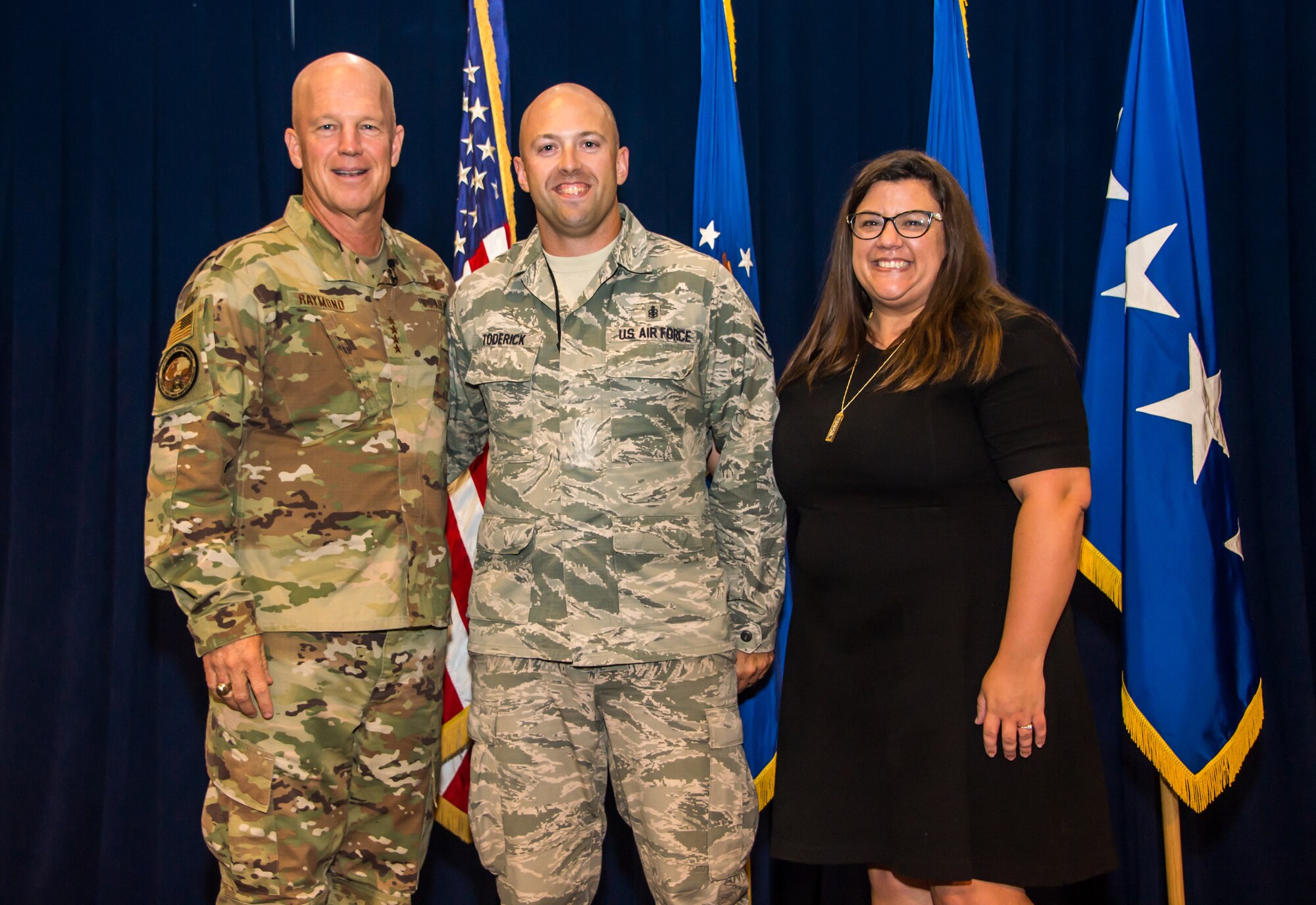 Gen. Jay Raymond, U.S. Space Command and Air Force Space Command commander, promotes SSgt Michael Toderick, 61st Medical Squadron non-commisioned officer in charge of community health, to the rank of Tech. Sgt. as a part of the Stripes for Exceptional Performers program (STEP), while visiting the Space and Missile Systems Center, Los Angeles Air Force Base, El Segundo, Calif., Oct. 1, 2019. Tech. Sgt. Toderick’s spouse, Jennette Toderick, surprised him on stage after the announcement. The STEP program identifies and promotes the Air Force’s best performing Airmen. Each calendar year, major commands, Field Operating Agency and Direct Reporting Unit commanders, and senior Air Force officers with large enlisted populations are authorized to select a limited number of Airmen with exceptional potential for promotion to the ranks of Staff and Tech. Sgt. STEP-promotions are a rare honor and Gen. Raymond had only one stripe to give this year for the entire Command.

(U.S. Air Force photo by Van De Ha)