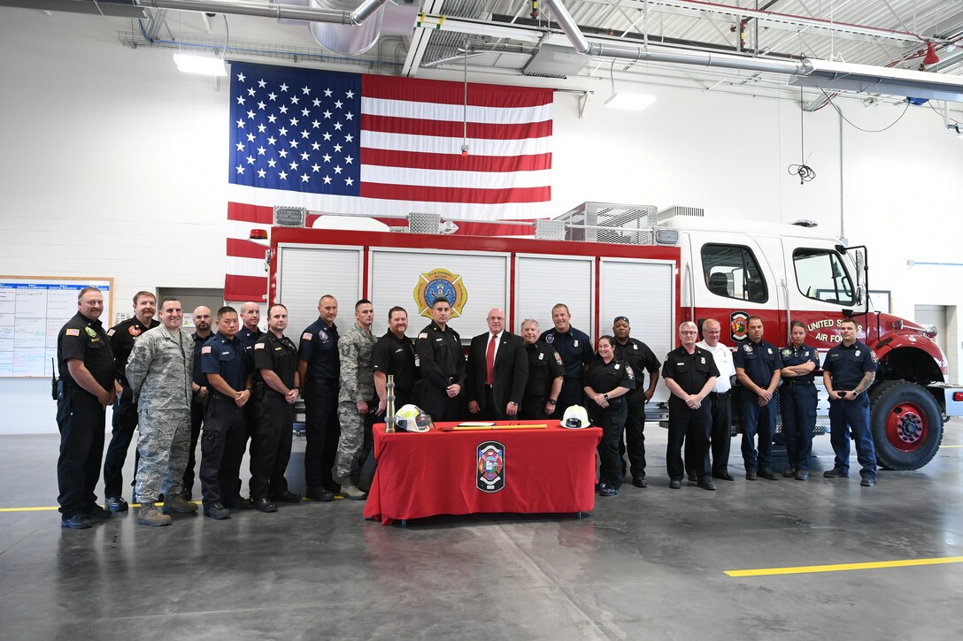 Firefighters and personnel from the 75th Civil Engineer Group gather for a group photo at the signing of a Fire Week Prevention proclamation signing Oct. 3, 2019, at Hill Air Force Base, Utah.