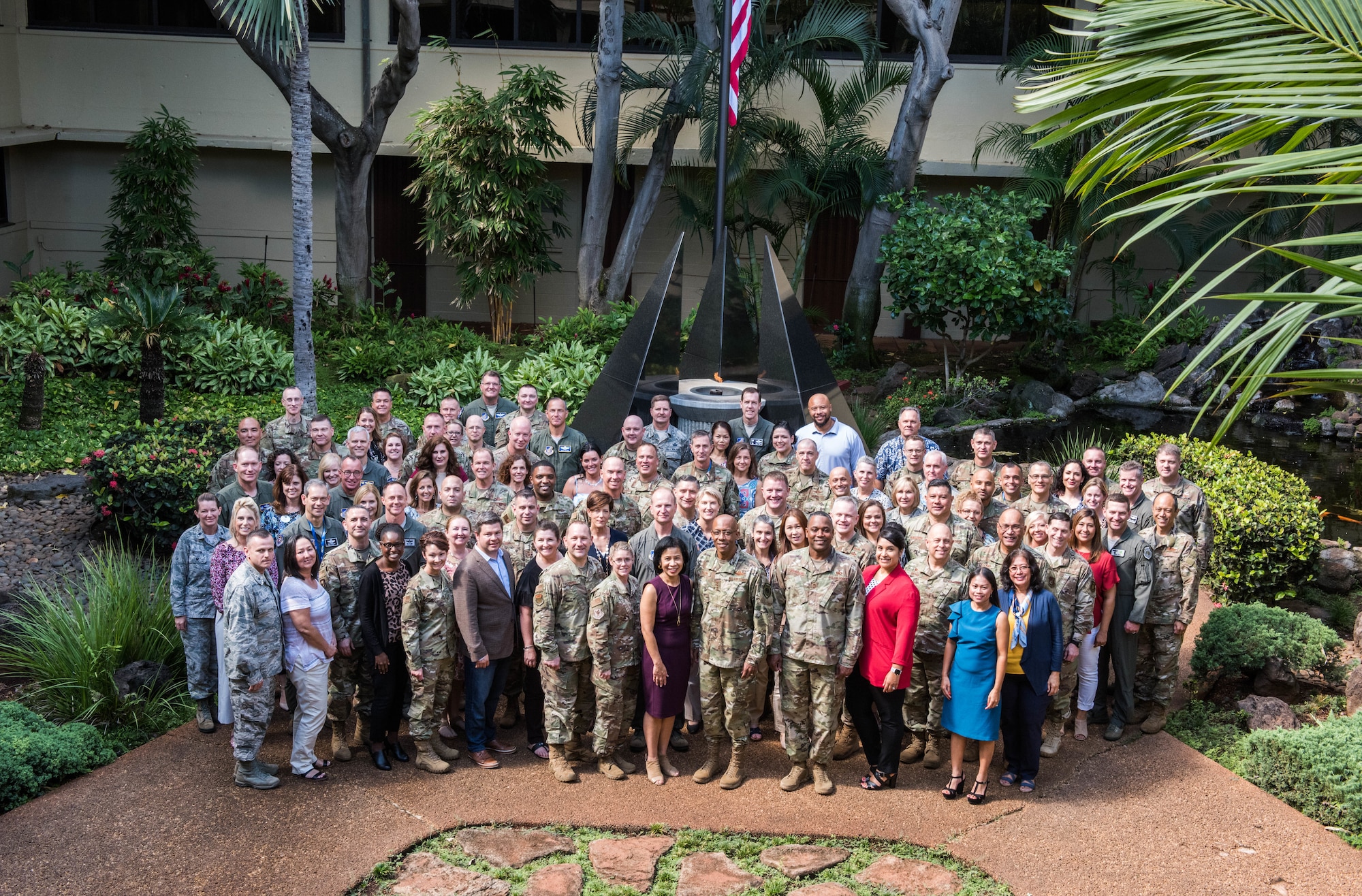 Commanders, command chiefs, directors and spouses from across the Pacific Air Forces (PACAF) area of responsibility pose for a group photo at Headquarters PACAF, Joint Base Pearl Harbor-Hickam, Hawaii  during the fall commander’s conference, Sept. 24 to 26.  The conference is designed to bring together senior leaders to discuss the many opportunities and challenges in the region as well as to discuss the progress on executing the command’s strategy. (U.S. Air Force photo by Staff Sgt. Hailey Haux)