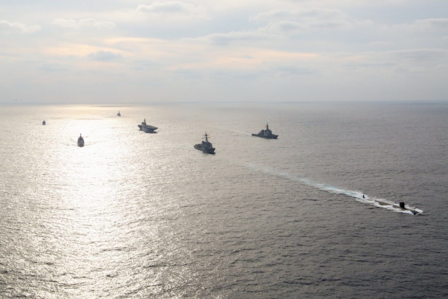 AT SEA (Sept. 30, 2019) The Los Angeles-class fast attack submarine USS Oklahoma City (SSN 723), assigned to Commander, Submarine Squadron 15, steams ahead of U.S., Japan Maritime Self-Defense Force (JMSDF), and Indian ships during the Malabar 2019 Photo Exercise (PHOTOEX). An annual, multinational, naval field training exercise, Malabar is designed to improve the collective maritime relationship between the JMSDF, Indian and U.S. navies. (Photo courtesy of JMSDF Public Affairs)