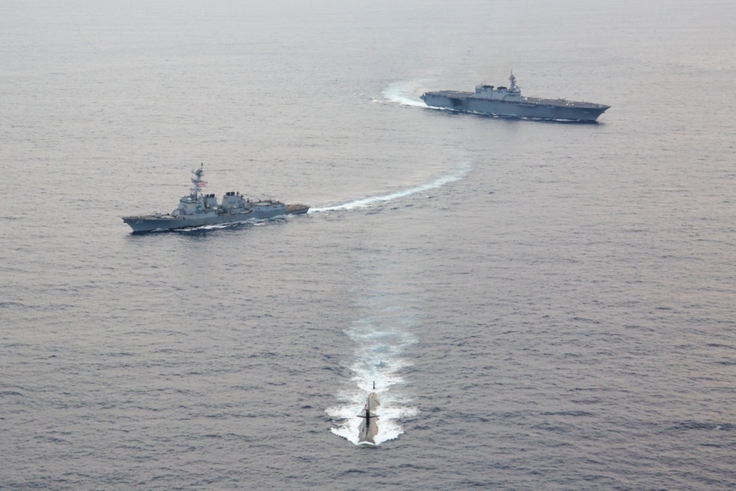 AT SEA (Sept. 30, 2019) The Los Angeles-class fast attack submarine USS Oklahoma City (SSN 723), assigned to Commander, Submarine Squadron 15, steams ahead of U.S., Japan Maritime Self-Defense Force (JMSDF), and Indian ships during the Malabar 2019 Photo Exercise (PHOTOEX). An annual, multinational, naval field training exercise, Malabar is designed to improve the collective maritime relationship between the JMSDF, Indian and U.S. navies. (Photo courtesy of JMSDF Public Affairs)