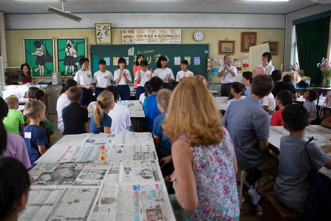 U.S. Marines and families from Marine Corps Air Station Iwakuni participate in a community cultural exchange with local Japanese children at Tsuzu Elementary School, Iwakuni City, Japan, Aug. 29.