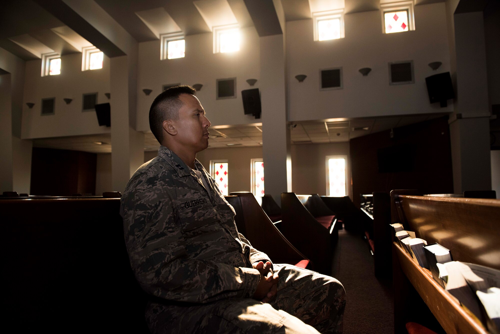 U.S. Air Force Capt. Genesis Guerrero, a 39th Air Base Wing chaplain, meditates in the chapel at Incirlik Air Base, Turkey, Oct. 2, 2019. The chaplain survived a challenging childhood due to his father’s troubled lifestyle, but the pair reconciled after the younger Guerrero found his faith at the age of 18. (U.S. Air Force photo by Staff. Sgt. Joshua Magbanua)