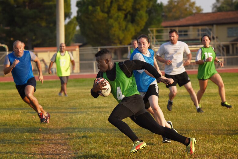 U.S. Air Force Staff Sgt. Osasumwen Edomwandagbon, 39th Medical Operations Squadron mental health supervisor, runs with the ball during a rugby game Sept. 14, 2019, at Incirlik Air Base, Turkey. Rugby enthusiast at Incirlik recently formed a league which they hope will become a permanent presence on the installation. (U.S. Air Force Photo by Staff Sgt. Joshua Magbanua)