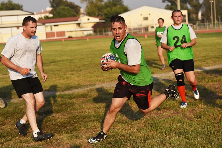 U.S. Air Force Staff Sgt. Spencer Johnson, 39th Security Forces Squadron non-commissioned officer in charge of electronic security systems, runs with the ball during a rugby game Sept. 14, 2019, at Incirlik Air Base, Turkey. Although the sport is popular in most former British colonies, rugby’s presence in the U.S. is overshadowed by its offspring, American football. (U.S. Air Force Photo by Staff Sgt. Joshua Magbanua)