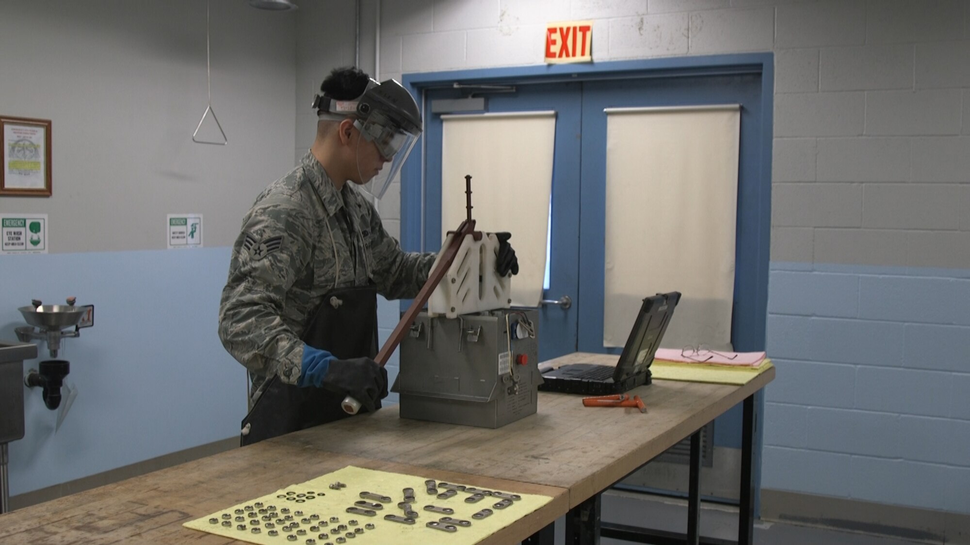 Senior Airman Brandon Dinh, an electro-environmental technician from the 446th Maintenance Squadron at Joint Base Lewis-McChord, Wash., demonstrates use of the Battery Cell Extraction Tool.  Airmen at the 446th MXS entered the newly forged tool in the Spark Tank 2020 competition.