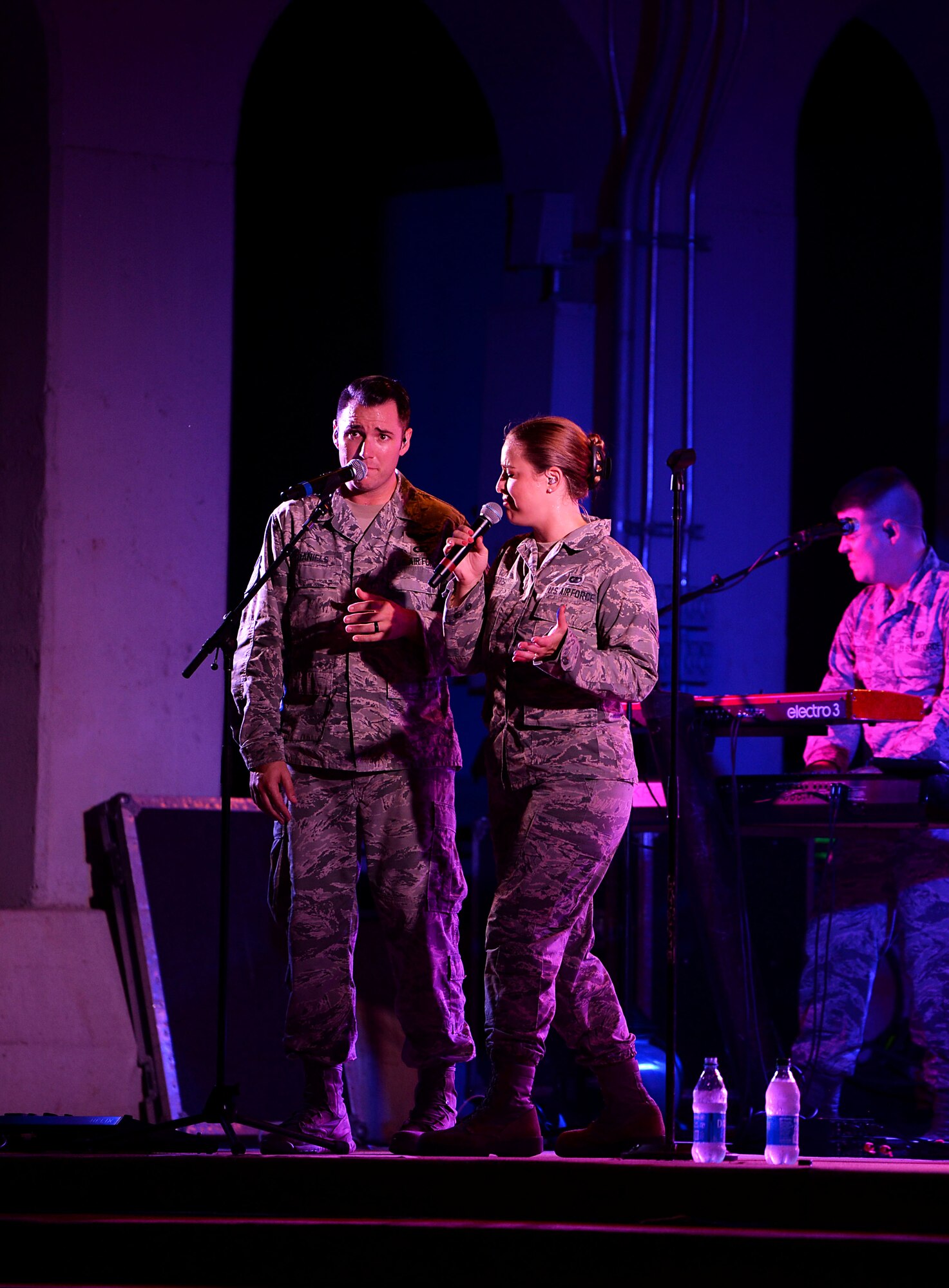 Airman 1st Class Courtney Woods and Tech. Sgt. Nick Daniels, U.S. Air Force Band of the West’s Top Flight vocalists, sing together during the Top Flight concert at the Columbus Riverwalk Stage Sept. 27, 2019, in Columbus, Miss. Members of Top Flight include Woods and Daniels on vocals, Tech. Sgt. Greg Lacy on guitar, Tech. Sgt. Troy Griffin on drums, Master Sgt. Mark Frandsen on bass, and Master Sgt. Nick Wellman as the audio engineer. (U.S. Air Force photo by Airman 1st Class Hannah Bean)