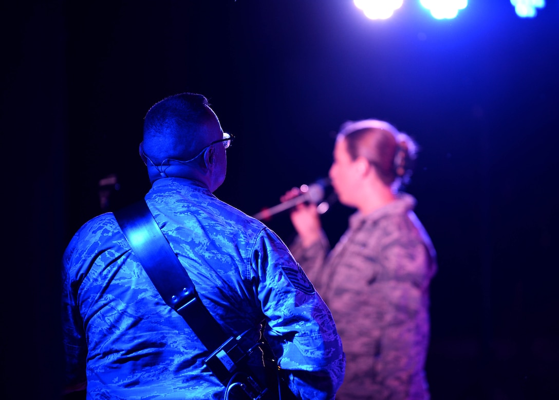 Tech. Sgt. Greg Lacy, U.S. Air Force Band of the West’s Top Flight guitarist, strums his electric guitar during the Top Flight concert at the Columbus Riverwalk Stage Sept. 27, 2019, in Columbus, Miss. Like other ensembles within the U.S. Air Force Band of the West, Top Flight performs in support of official military gatherings, Air Force recruiting and community relations events. They provide a variety of music for dances, dinner shows and receptions. (U.S. Air Force photo by Airman 1st Class Hannah Bean)