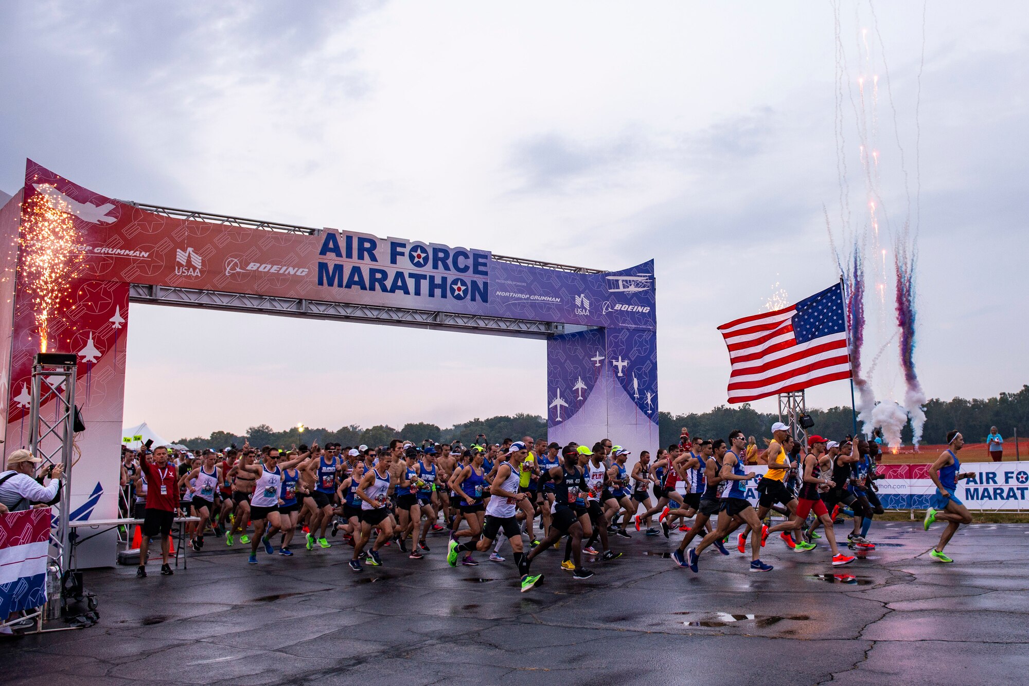 Fireworks go off at the start off the Air Force Marathon held on Sept. 21 at Wright-Patterson Air Force Base, Ohio. Fireworks at the start line was added to this year’s marathon to add more excitement and entertainment to the race. (U.S. Air Force photo/Wesley Farnsworth)