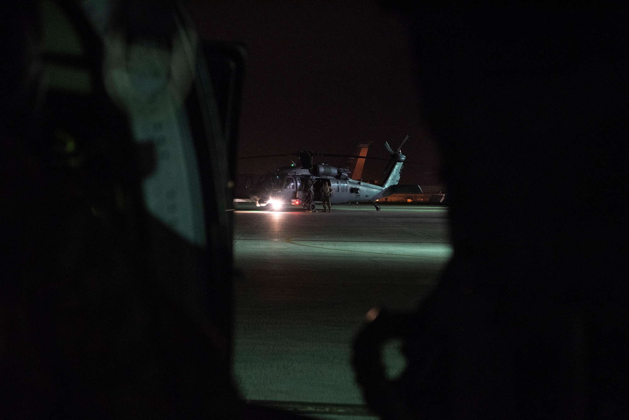 A 33rd Rescue Squadron HH-60 Pave Hawk crew prepare for a flight Sept. 18, 2019, at Kadena Air Base, Japan. The 33rd RQS specializes in rescuing personnel from hostile or austere situations. (U.S. Air Force photo by Senior Airman Rhett Isbell)