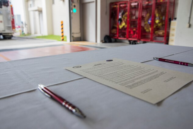Colonel Fredrick Lewis signs Fire Prevention Proclamation