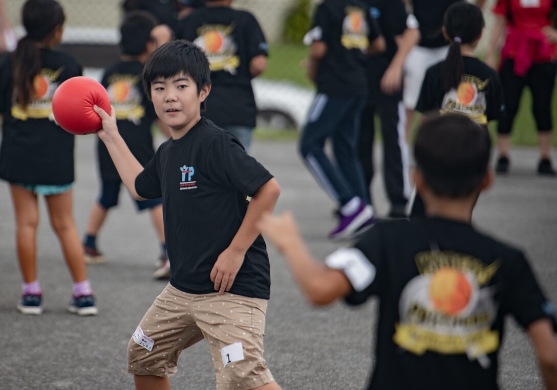 Children from Okinawa and the Kadena Youth Center play dodgeball during Cultural Exchange Day, Sept. 28, 2019, at Kadena Air Base, Japan. In addition to playing American and Japanese games, the children enjoyed American and Japanese cuisine. (U.S. Air Force photo by Staff Sgt. Micaiah Anthony)
