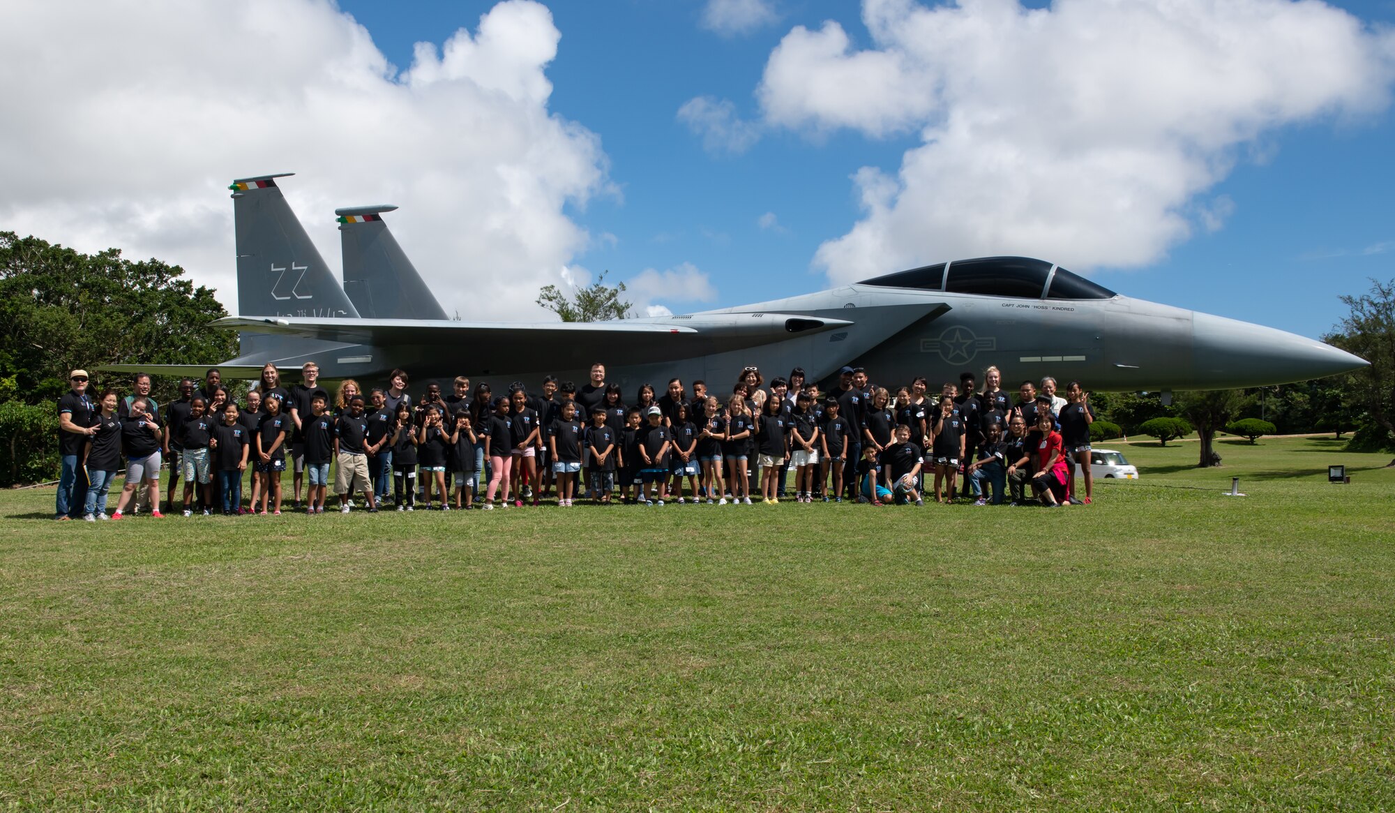 Children from Okinawa and the Kadena Youth Center pose for a photo during Cultural Exchange Day, Sept. 28, 2019, at Kadena Air Base, Japan. The event enabled 49 children from Okinawa and the military community to play and interact with each other through a variety of both American and Japanese games and challenges. (U.S. Air Force photo by Staff Sgt. Micaiah Anthony)
