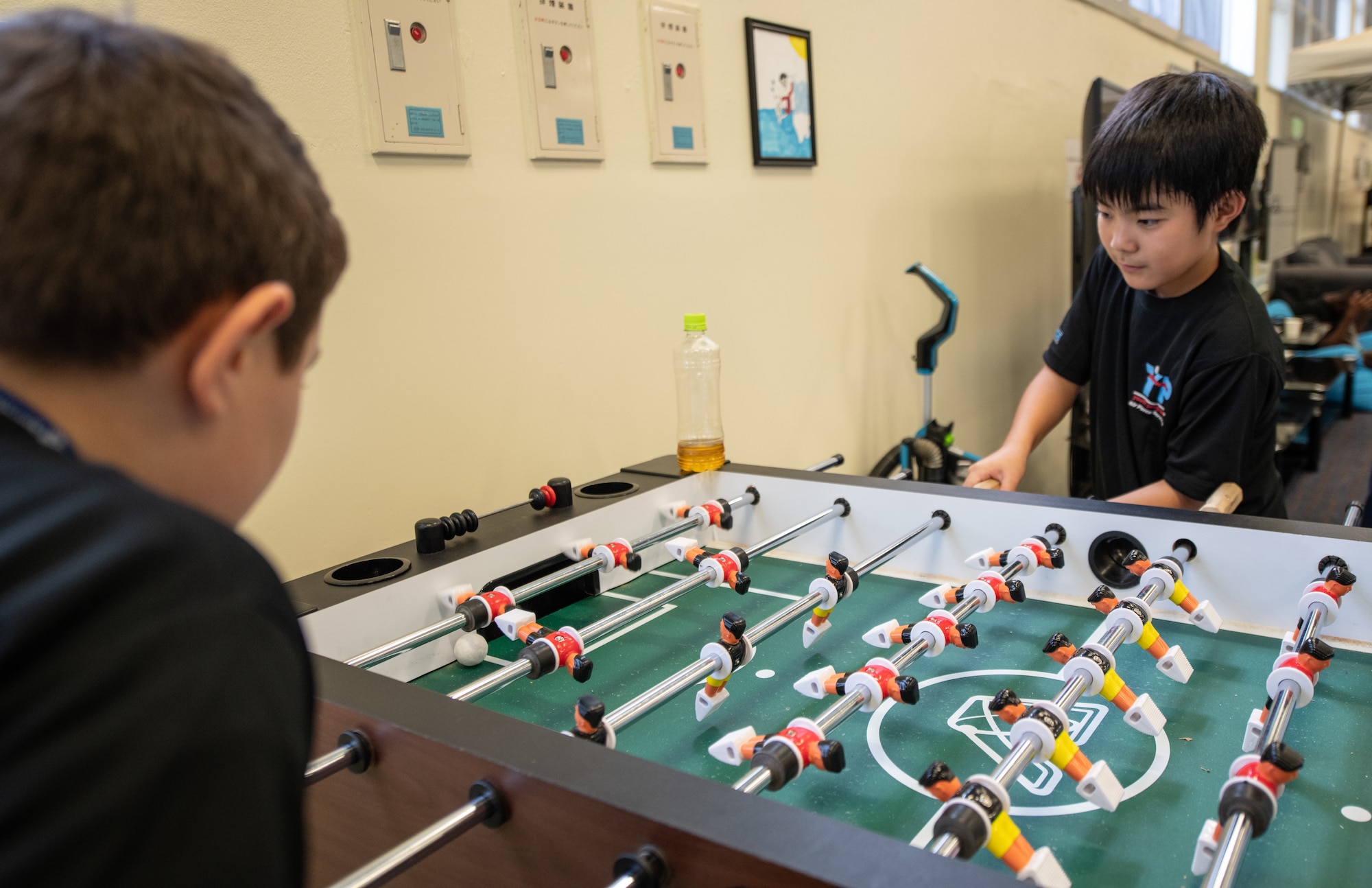 Children play foosball during Cultural Exchange Day, Sept. 28, 2019, at Kadena Air Base, Japan. The event enabled 49 children from Okinawa and the military community to play and interact with each other through a variety of both American and Japanese games and challenges. (U.S. Air Force photo by Staff Sgt. Micaiah Anthony)