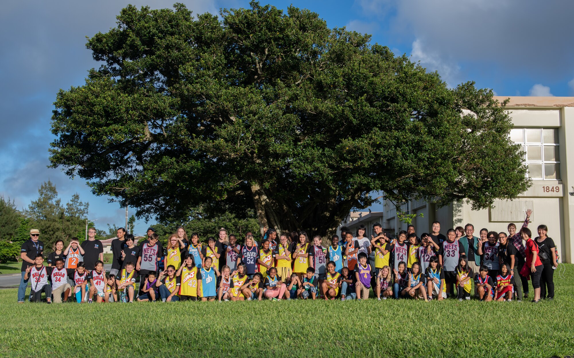 Children from Okinawa and the Kadena Youth Center pose for a photo during Cultural Exchange Day Sept. 28, 2019, at Kadena Air Base, Japan. The event enabled 49 children from Okinawa and the military community to play and interact with each other through a variety of both American and Japanese games and challenges. (U.S. Air Force photo by Staff Sgt. Micaiah Anthony)