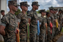 U.S. Marines with 12th Marine Regiment, 3rd Marine Division, participates in the 12th Marine Regiment 92nd Anniversary Battle Colors Rededication Ceremony on Camp Hansen, Okinawa, Japan, Oct. 4, 2019. The ceremony is an opportunity for Marines to remember warriors past and to recognize contributions of service members and families to current operations. (U.S. Marine Corps photo by Lance Cpl. D’Angelo Yanez)