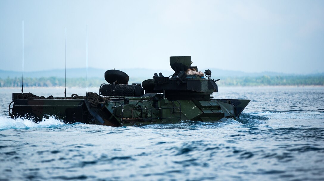 U.S. Marines with 3rd Marine Division conduct ship-to-shore movements in Assault Amphibious Vehicles (AAV) before the start of exercise Tiger Strike 19 in the Celebes Sea, Malaysia, on Sept. 30, 2019. Utilizing AAVs, Marines disembarked the USS Green Bay (LPD-20), landed on Blue Beach, Malaysia, then brought back members of the Malaysian Armed Forces (MAF) aboard the vessel to participate in the opening ceremony for exercise Tiger Strike 19 and a tour. Tiger Strike 19 focuses on strengthening joint military interoperability and on increasing readiness by practicing for humanitarian assistance, disaster relief, amphibious and jungle warfare operations, all while fostering cultural exchanges between the MAF and the U.S. Navy, Marine Corps team. (U.S. Marine Corps photo by Cpl. Josue Marquez)