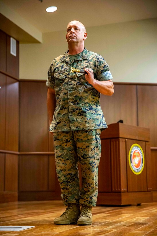 U.S. Marine Corps Sgt. Maj. Darby J. Noonan, the outgoing sergeant major of Force Headquarters Group, holds the noncommissioned officer’s sword during a relief and appointment ceremony at Marine Corps Support Facility New Orleans, Oct. 3, 2019. Noonan relinquished his duties to Sgt. Maj. Michael S. Payne, the incoming sergeant major of FHG. Payne came to Marine Forces Reserve from his previous command of Staff Noncommissioned Officer Academy in Okinawa, Japan, where he served as the director. (U.S. Marine Corps photo by Sgt. Andy O. Martinez)