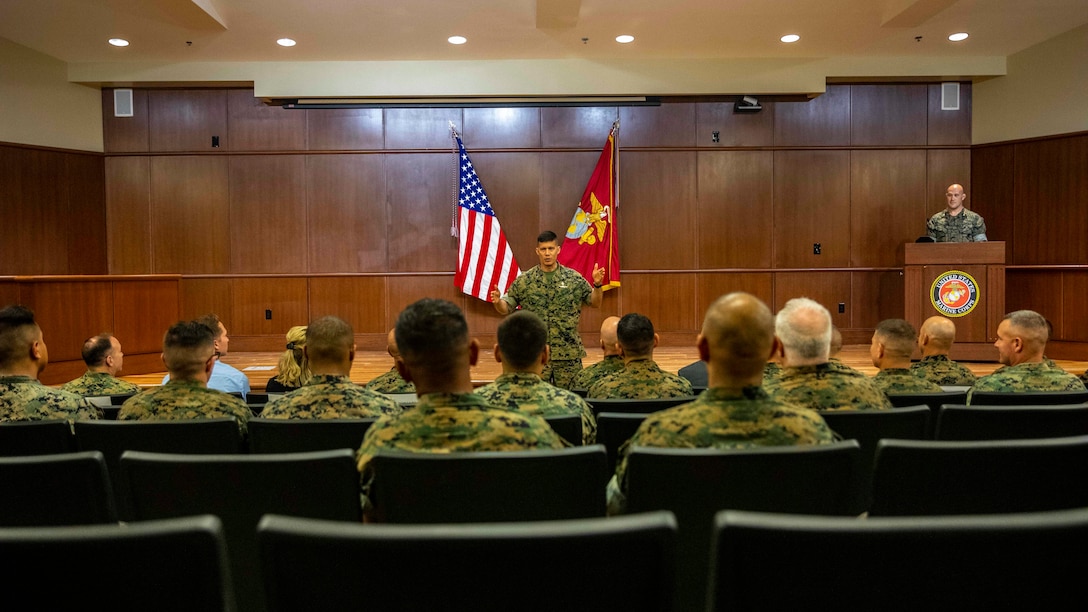 U.S. Marine Corps Brig. Gen. Mark A. Hashimoto, center, the commanding general of Force Headquarters Group, speaks to the audience during a relief and appointment ceremony at Marine Corps Support Facility New Orleans, Oct. 3, 2019. Sgt. Maj. Darby J. Noonan, center, the outgoing sergeant major of Force Headquarters Group, relinquished his duties as FHG sergeant major to Sgt. Maj. Michael S. Payne. Payne came to Marine Forces Reserve from his previous command of Staff Noncommissioned Officer Academy in Okinawa, Japan, where he served as the director. (U.S. Marine Corps photo by Sgt. Andy O. Martinez)