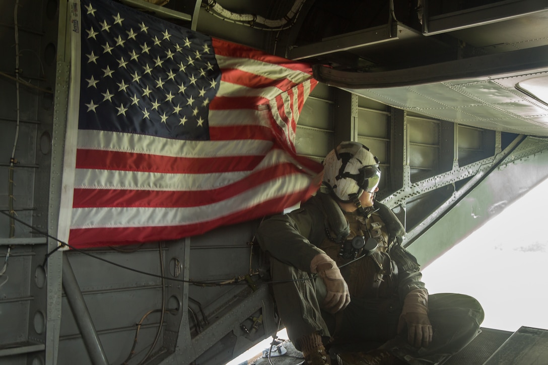 U.S. Marine Sgt. Scott Veck, a CH-53E Super Stallion helicopter crew chief with Special Purpose Marine Air-Ground Task Force - Southern Command, observes flight operations in Coveñas, Colombia, Sept. 30, 2019, during a humanitarian assistance and disaster relief rehearsal. The exercise will test and strengthen the interoperability and responsiveness between these countries, preparing for real-world disaster scenarios in the region.  The task force is conducting training and engineering projects hand-in-hand with partner nation military members in Latin America and the Caribbean during their deployment to the region, which coincides with hurricane season. Veck is a native of Parker, Colorado.