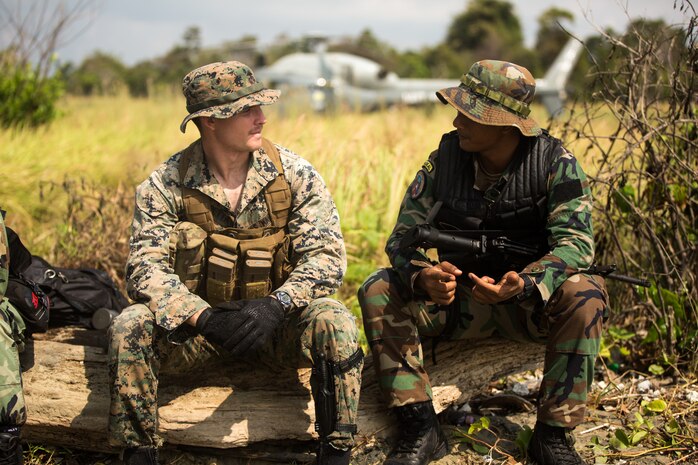 A U.S. Marine meets a member of the Malaysian Armed Forces’ Royal Malaysian Navy at Blue Beach, Malaysia, on Sept. 30.