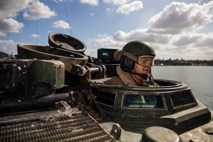 U.S. Marine Pfc. Wyatt Fender, a student with Assault Amphibian School Battalion, Training Command, conducts a communications check in an AAV-P7/A1 Amphibious Assault Vehicle prior to basic water and amphibious operations at the 21 Area boat basin on Marine Corps Base Camp Pendleton, California, Oct. 1, 2019. This training is meant to teach students basic amphibious operations like going to and from shore. The mission of the battalion is to teach Marines in Amphibious Assault Vehicle operations and maintenance while assisting in the development of formal training and logistical evaluations of new AAV systems. Fender is a native of Valdosta, Georgia.