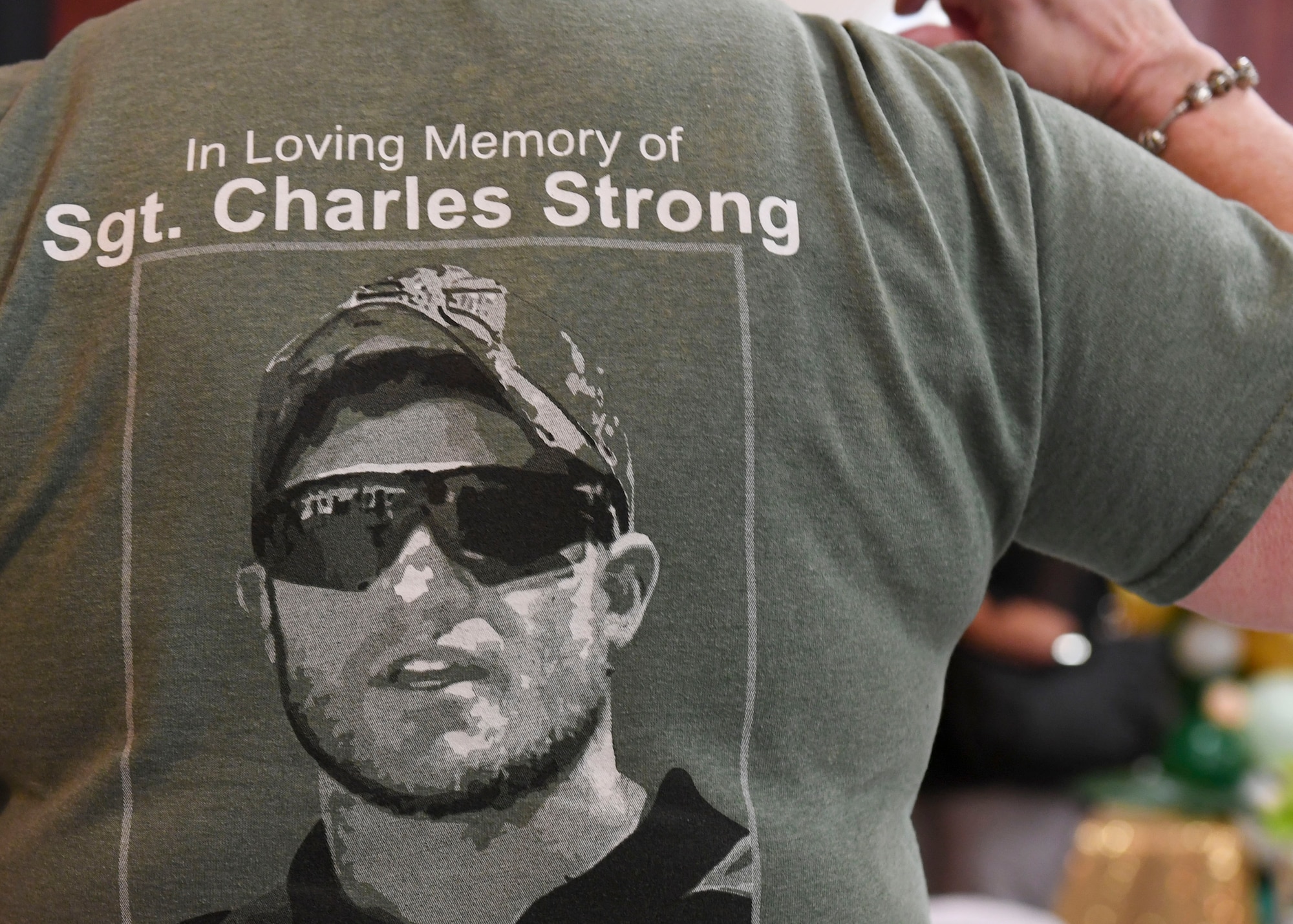An event attendee wears a shirt in remembrance of her son, U.S. Marine Sgt. Charles Strong, 2nd Marine Special Operations Battalion critical skills operator, during the Gold Star Mothers and Families Day luncheon at Joint Base Langley-Eustis, Virginia, Sept. 29, 2019.