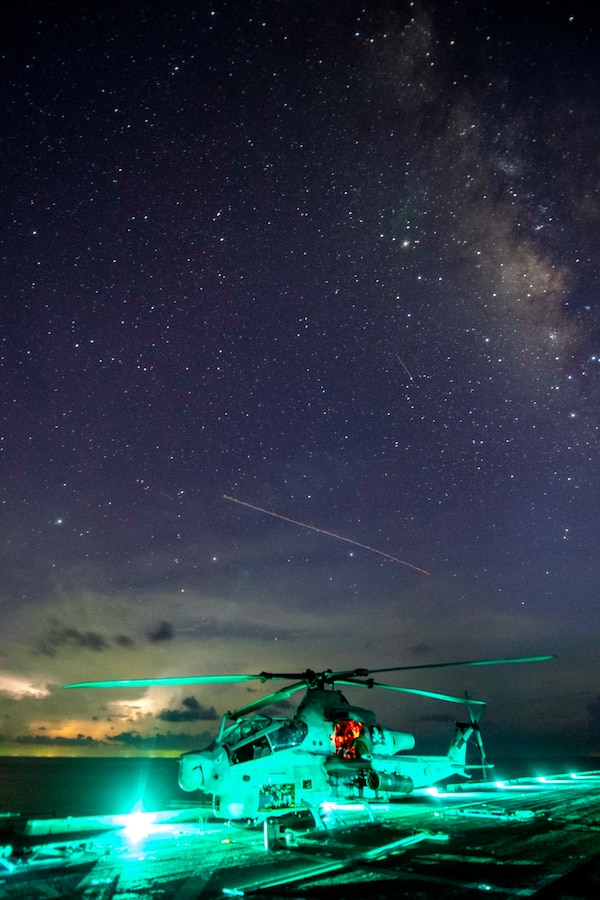 190930-N-NB544-1009 SOUTH CHINA SEA (Sept. 30, 2019) A Marine, assigned to Marine Medium Tiltrotor Squadron (VMM) 163 (Reinforced), conducts maintenance on an AH-1Z Viper aboard the amphibious transport dock ship USS John P. Murtha (LPD 26). John P. Murtha is currently on its first deployment and part of the Boxer Amphibious Ready Group (ARG) and 11th Marine Expeditionary Unit (MEU) team and is deployed to the U.S. 7th Fleet area of operations to support regional stability, reassure partners and allies, and maintain a presence postured to respond to any crisis ranging from humanitarian assistance to contingency operations. (U.S. Navy photo by Mass Communication Specialist 2nd Class Kyle Carlstrom)