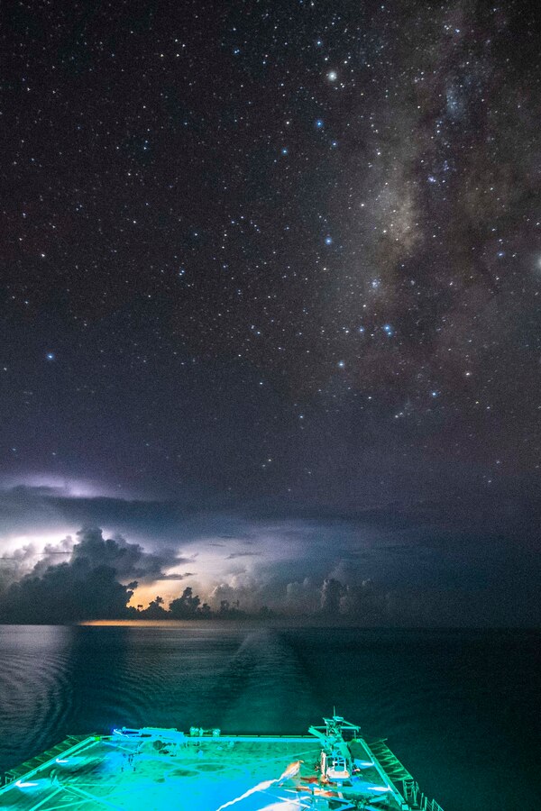 190930-N-NB544-1086 SOUTH CHINA SEA (Sept. 30, 2019) The amphibious transport dock ship USS John P. Murtha (LPD 26) transits past a lightning storm in the South China Sea. John P. Murtha is currently on its first deployment and part of the Boxer Amphibious Ready Group (ARG) and 11th Marine Expeditionary Unit (MEU) team and is deployed to the U.S. 7th Fleet area of operations to support regional stability, reassure partners and allies, and maintain a presence postured to respond to any crisis ranging from humanitarian assistance to contingency operations. (U.S. Navy photo by Mass Communication Specialist 2nd Class Kyle Carlstrom)