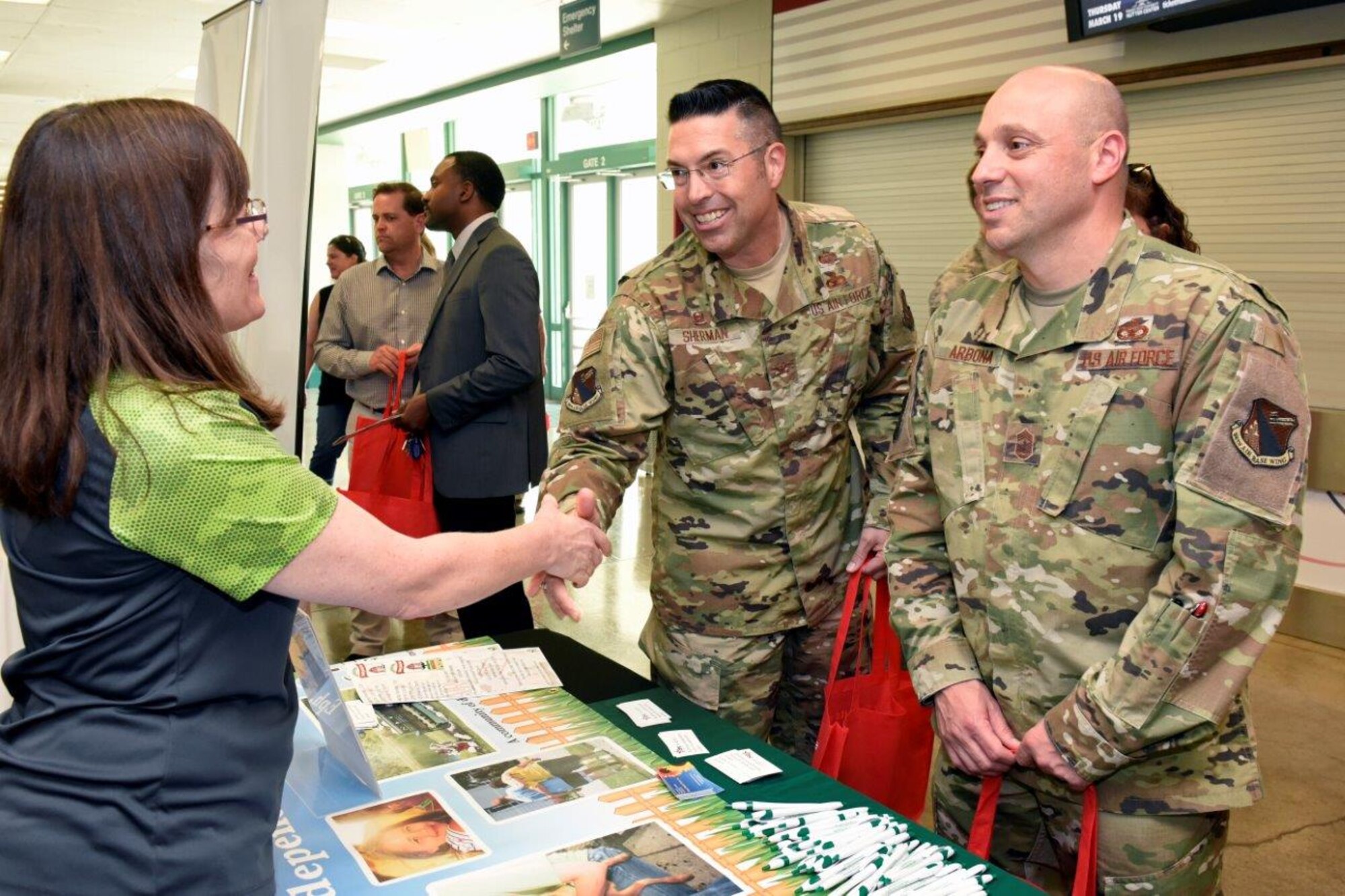 Col. Thomas Sherman, 88th Air Base Wing and installation commander, Wright-Patterson Air Force Base, and Chief Master Sgt. Stephen Arbona, 88 ABW command chief, visit booths for the Combined Federal Campaign kickoff event. (U.S. Air Force photo/Ty Greenlees)