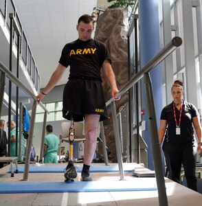 Candace Pellock, physical therapy assistant, guides with Spc. Ezra Maes at the Center for the Intrepid, Brooke Army Medical Center’s cutting-edge rehabilitation center on Joint Base San Antonio-Fort Sam Houston, Oct. 2, 2019.
