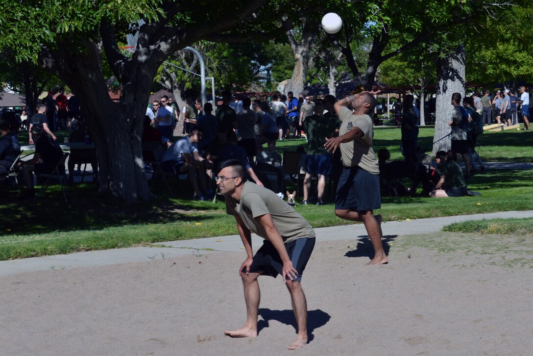 A member of the 58th Operations Support Squadron prepares to hit a serve during the 2019 Special Operations Wing Sports Day at Kirtland Air Force Base, N.M., Sept. 27, 2019. The sports day included a competition between all the squadrons in the wing with top placements in every sport earning points for the unit. The 58th Aircraft Maintenance Squadron won the competition with almost double the points of the second place squadron.