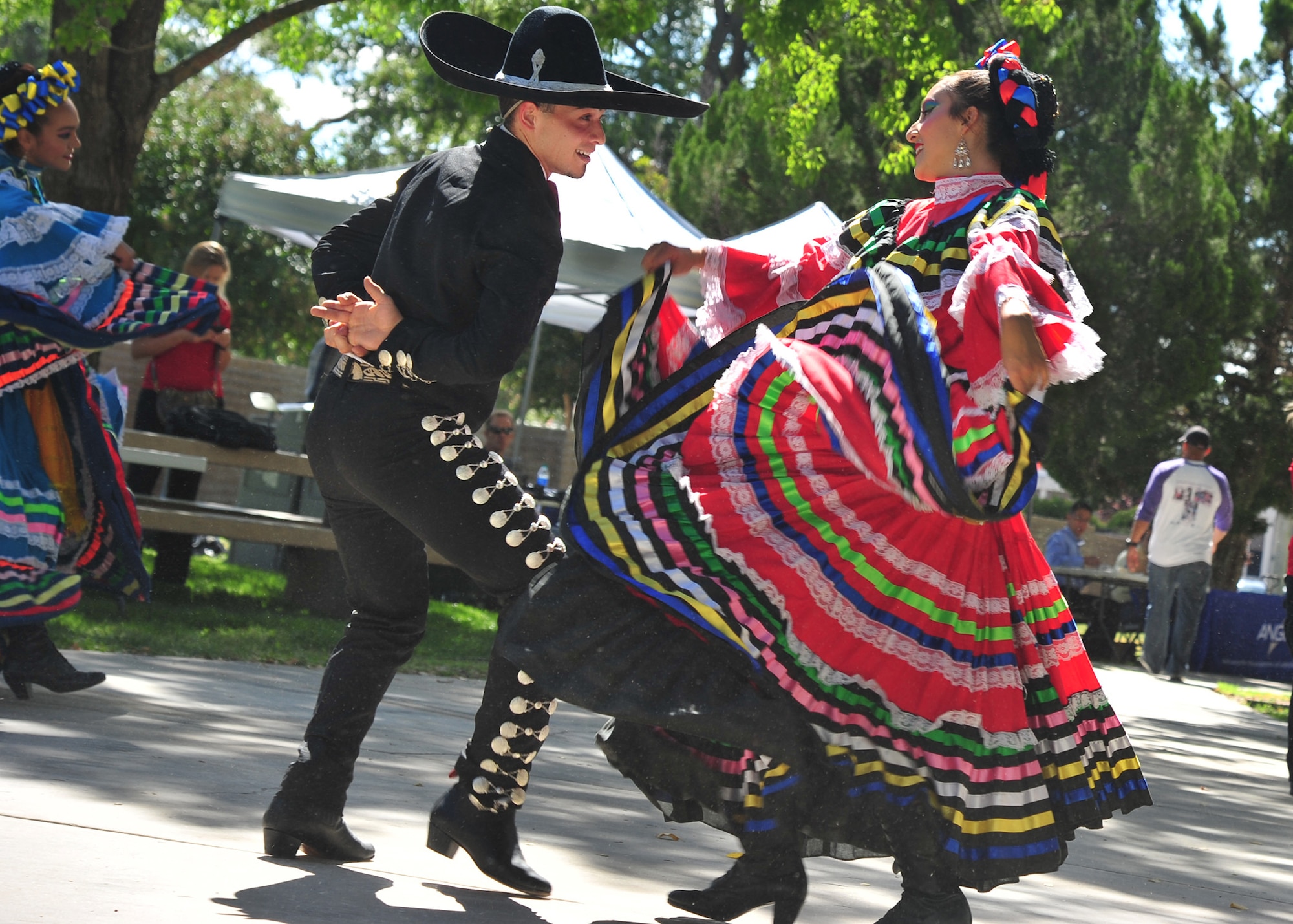 Dancers at the Hispanic Heritage Month festival perform a folkloric dance at Kirtland Air Force Base, N.M., Oct. 3, 2019. Hispanic Heritage Month is celebrated from Sept. 15 to Oct. 15 each year to recognize the contributions of Hispanic and Latino Americans to the country's history, heritage and culture. (U.S. Air Force photo by Airman 1st Class Ireland Summers)