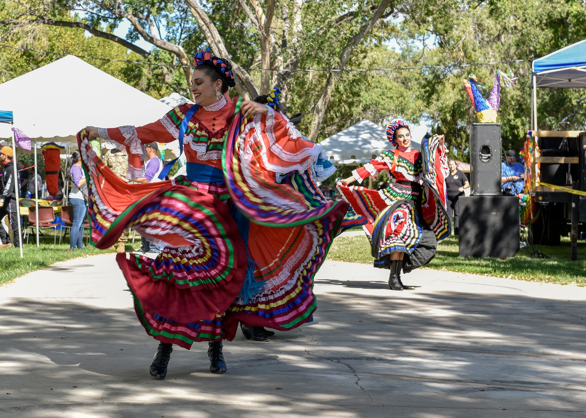 Dancers at the Hispanic Heritage Month festival perform a folkloric dance at Kirtland Air Force Base, N.M., Oct. 3, 2019. People belonging to the various units on base and mission partners of Kirtland AFB attended the festivities. (U.S. Air Force photo by Airman 1st Class Austin J. Prisbrey)