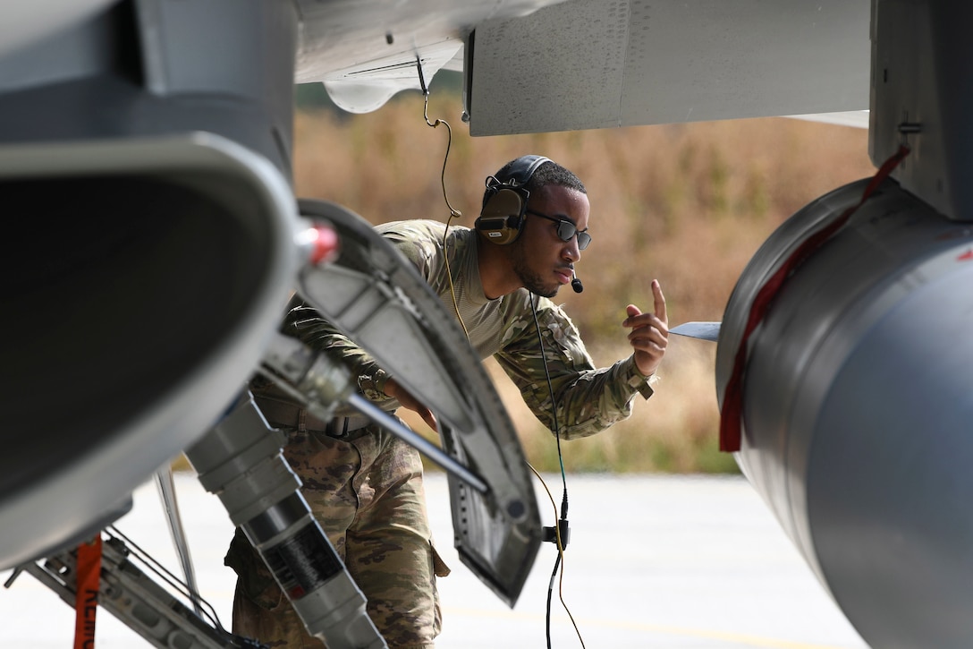 An airman refuels a military jet.