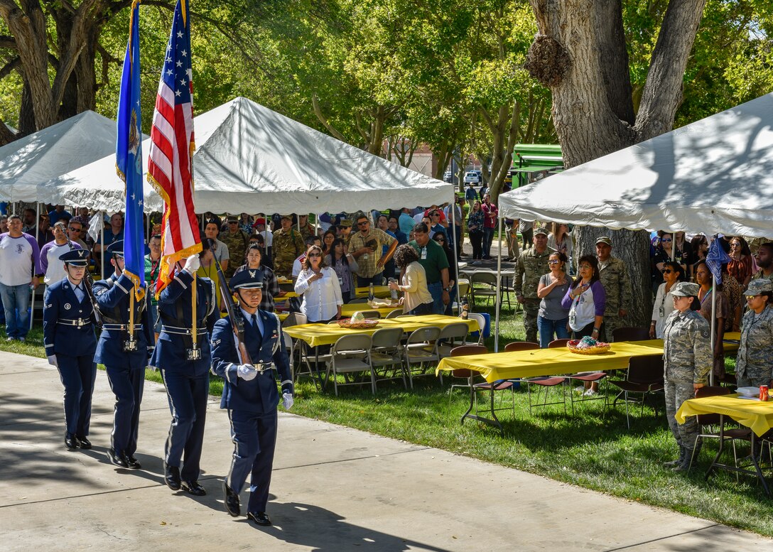 Members of the Kirtland Air Force Base Honor Guard present the colors at the Hispanic Heritage Month festival at Kirtland Air Force Base, N.M., Oct. 3, 2019. The festival featured live music, folkloric dance, food trucks, information booths, key note speakers and a car show. (U.S. Air Force photo by Airman 1st Class Austin J. Prisbrey)