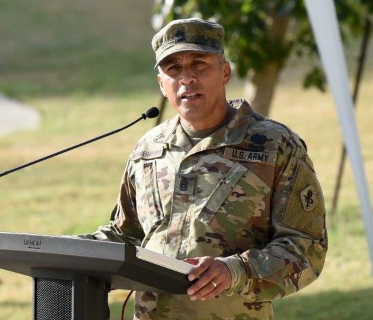 Command Sgt. Maj. Christopher Earle giving remarks at the MEDCoE change of responsibility ceremony.