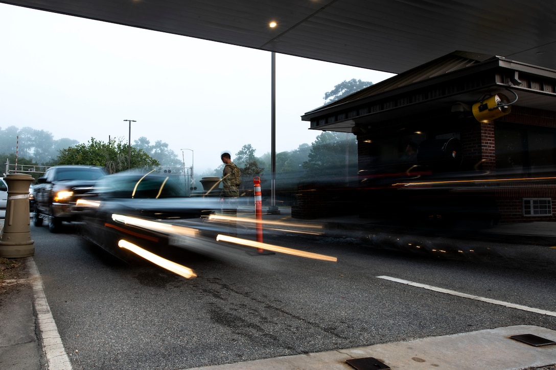 Installation entry controllers assigned to the 23d Security Forces Squadron verify ID cards Oct. 2, 2019, at Moody Air Force Base, Ga. Installation entry controllers serve as the first line of defense, keeping Moody’s assets and personnel safe from potential threats. (U.S. Air Force photo by Senior Airman Erick Requadt)