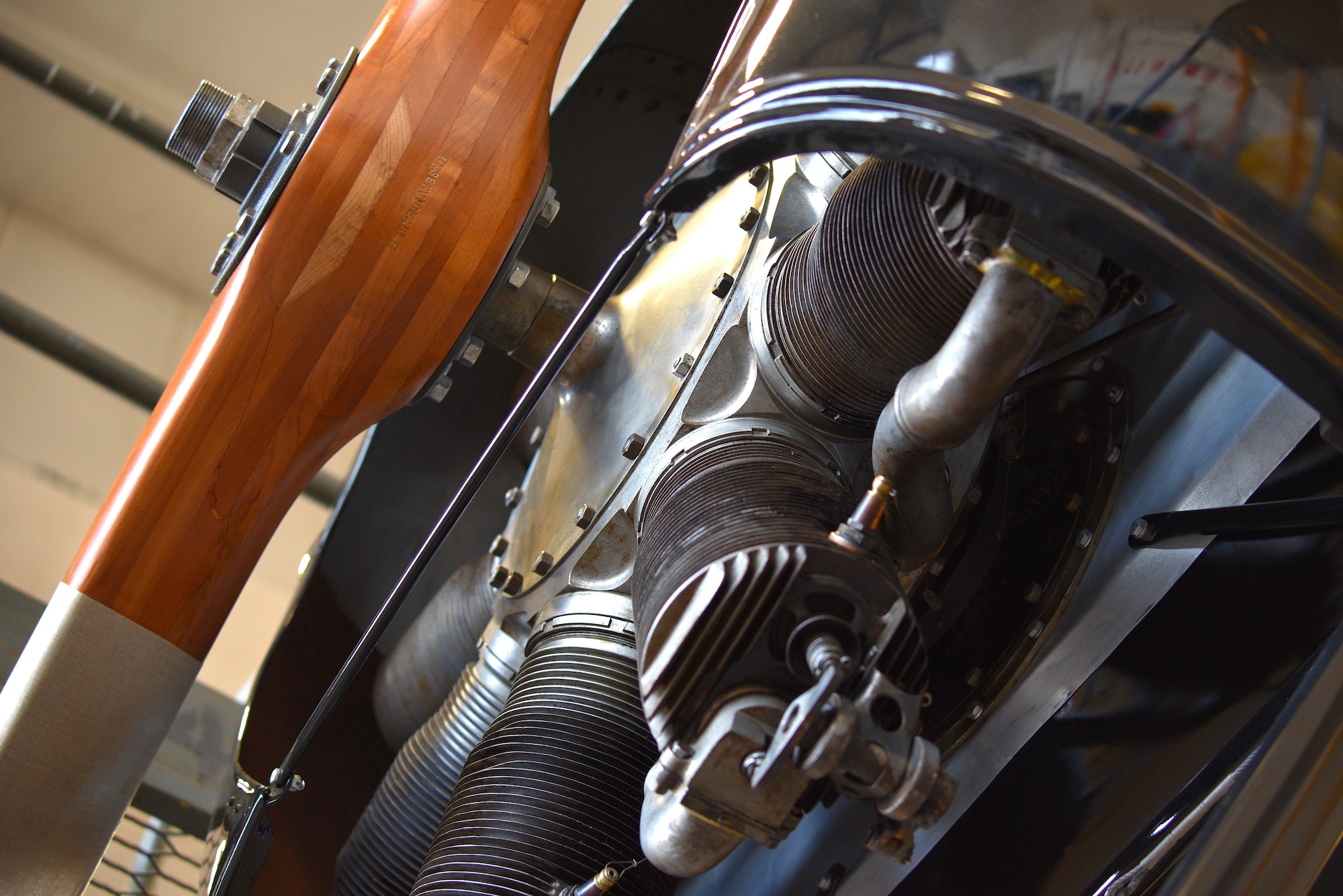View of biplane engine and propeller during restoration.