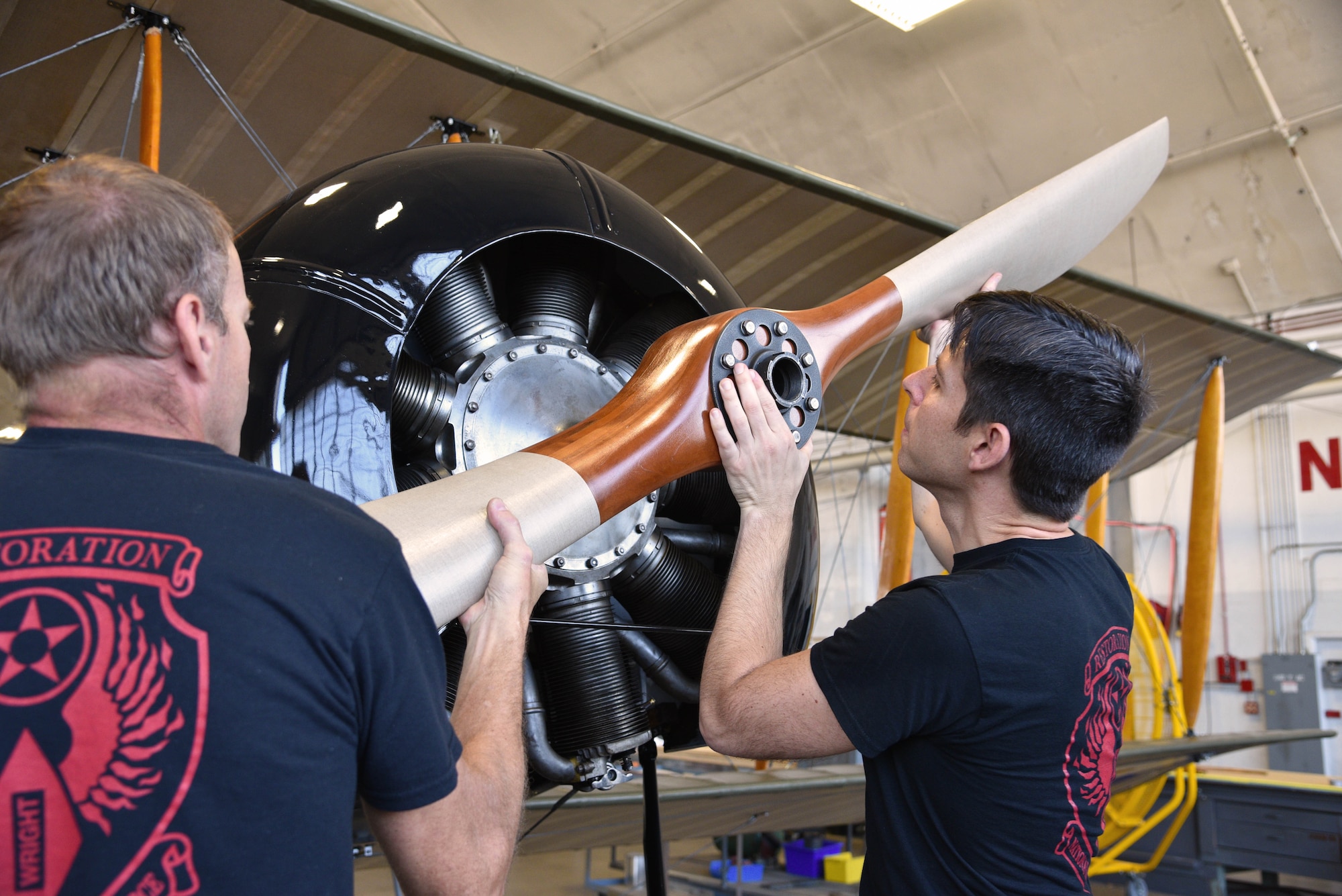 Propeller of a biplane being installed during restoration.