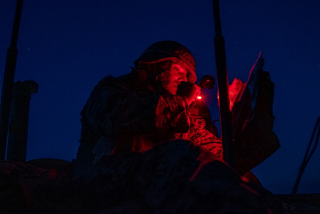 U.S. Marine Corps Staff Sgt. Marcos Luna, an exercise evaluator with 3rd Light Armored Reconnaissance Battalion, 1st Marine Division, looks at a map during a Marine Corps Combat Readiness Evaluation (MCCRE) at Marine Corps Air Ground Combat Center Twentynine Palms, California, Sept. 6, 2019. The MCCRE is used to formally evaluate Marines on their combat readiness prior to their upcoming deployment. (U.S. Marine Corps photo by Lance Cpl. Roxanna Ortiz)