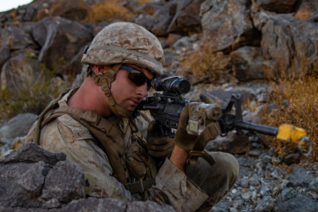 U.S. Marine Corps Cpl. Johnathan Wright, a mechanic with 3rd Light Armored Reconnaissance Battalion, 1st Marine Division, scans the surrounding area during a Marine Corps Combat Readiness Evaluation (MCCRE) at Marine Corps Air Ground Combat Center Twentynine Palms, California, Sept. 7, 2019. The MCCRE is used to formally evaluate Marines on their combat readiness prior to their upcoming deployment. (U.S. Marine Corps photo by Lance Cpl. Roxanna Ortiz)