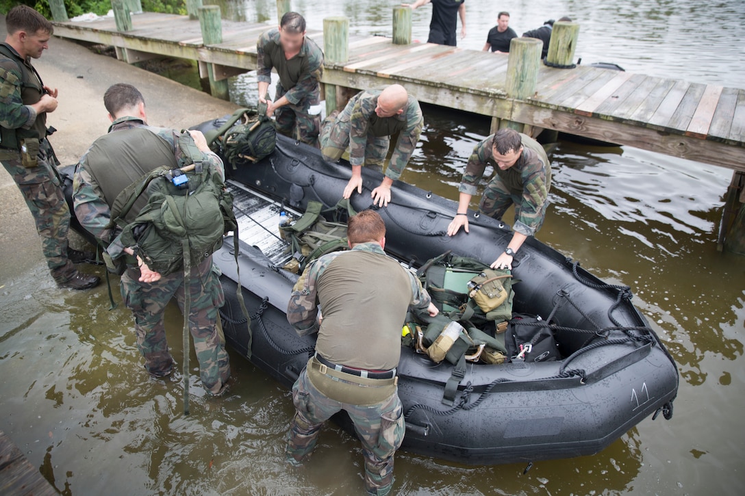 Marine Raiders prepare a combat rubber raiding craft (CRRC) for the boating portion of the annual Marine Forces Special Operations Command 2019 Marine Raider Competition on Marine Corps Base Camp Lejeune, N.C., June 12, 2019. The competition fostered camaraderie and tested participants’ operational capabilities consistent with special operations missions through a rigorous evolution of events and to honor Marine Raider heritage.  The competition consisted of six teams of six participants hailing from 1st Marine Raider Battalion, 2nd Marine Raider Battalion, 3rd Marine Raider Battalion, Marine Raider Training Center and 2nd Marine Reconnaissance Battalion. (U.S. Marine Corps photo by Cpl. Heather J. Atherton)
