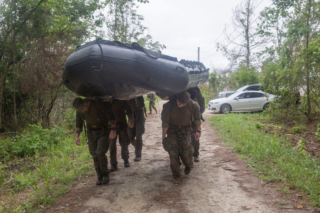 Marine Raiders carry a combat rubber raiding craft (CRRC) in preparation for the boating portion of the annual Marine Forces Special Operations Command 2019 Marine Raider Competition on Marine Corps Base Camp Lejeune, N.C., June 12, 2019. The competition fostered camaraderie and tested participants’ operational capabilities consistent with special operations missions through a rigorous evolution of events and to honor Marine Raider heritage.  The competition consisted of six teams of six participants hailing from 1st Marine Raider Battalion, 2nd Marine Raider Battalion, 3rd Marine Raider Battalion, Marine Raider Training Center and 2nd Marine Reconnaissance Battalion. (U.S. Marine Corps photo by Lance Cpl. Michael Neunehoff)