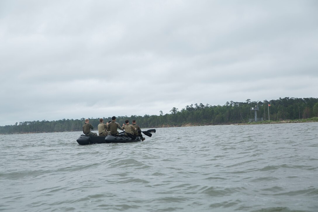 Marine Raiders paddle a combat rubber raiding craft (CRRC) across the bay for the boating portion of the annual Marine Forces Special Operations Command 2019 Marine Raider Competition on Marine Corps Base Camp Lejeune, N.C., June 12, 2019. The competition fostered camaraderie and tested participants’ operational capabilities consistent with special operations missions through a rigorous evolution of events and to honor Marine Raider heritage.  The competition consisted of six teams of six participants hailing from 1st Marine Raider Battalion, 2nd Marine Raider Battalion, 3rd Marine Raider Battalion, Marine Raider Training Center and 2nd Marine Reconnaissance Battalion. (U.S. Marine Corps photo by Sgt. Juan A. Soto-Delgado)