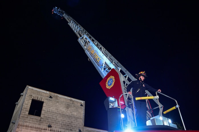 A base firefighter showcases the capability of the department’s new, 100-foot ladder truck during a training demonstration Oct. 1, 2019, at Hill Air Force Base, Utah. Hill AFB’s Fire and Emergency Services acquired the truck this summer to replace the department's 16-year-old truck. (U.S. Air Force photo by R. Nial Bradshaw)