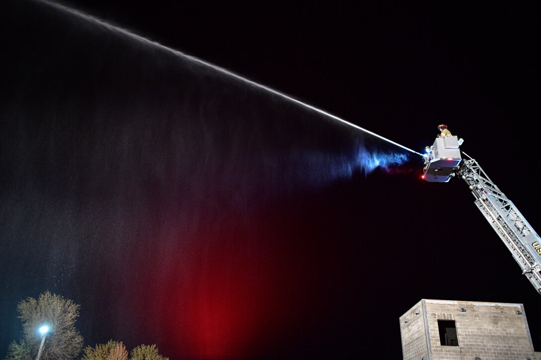 Base firefighters showcase the capability of the department’s new, 100-foot ladder truck and its ability to provide exposure protection during a training demonstration Oct. 3, 2019, at Hill Air Force Base, Utah. Hill AFB’s Fire and Emergency Services acquired the truck this summer to replace the department's 16-year-old truck. (U.S. Air Force photo by R. Nial Bradshaw)