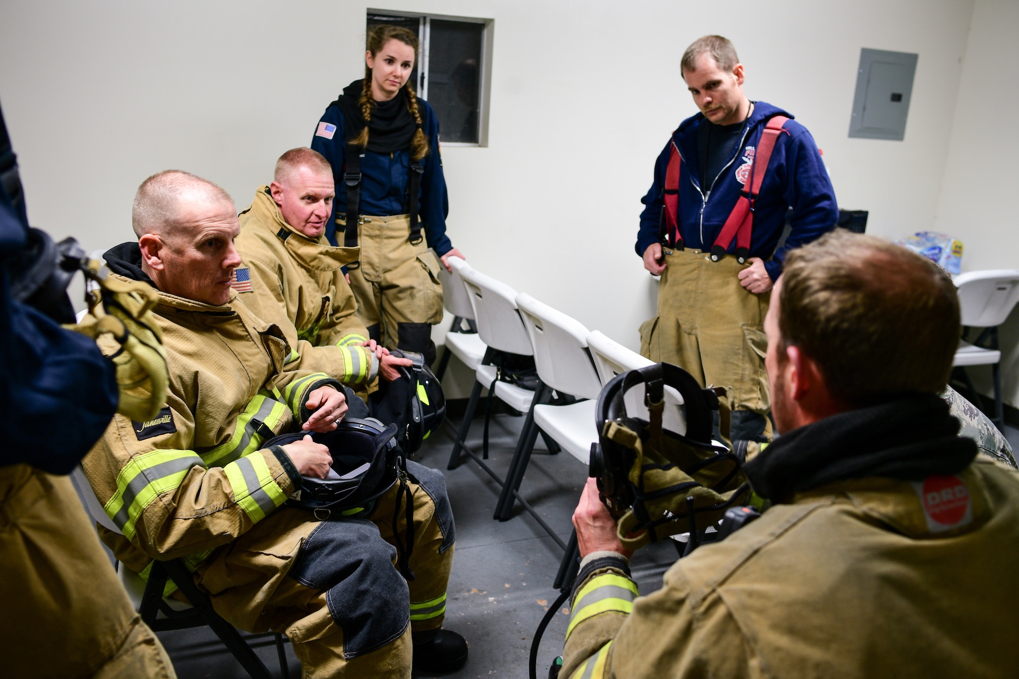 (Far left, left to right) Chief Master Sgt. Christopher Walker, 75th Air Base Wing command chief, and Col. Jon Eberlan, 75th ABW commander, during a safety briefing with base firefighters Oct. 1, 2019, at Hill Air Force Base, Utah. Walker and Eberlan took part in a Hill AFB Fire and Emergency Services training demonstration showcasing the capability a new, 100-foot ladder truck the department acquired this summer. (U.S. Air Force photo by R. Nial Bradshaw)