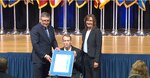 two people pose with award recipient