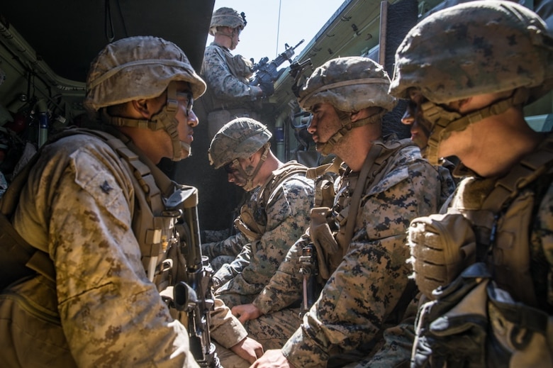 U.S. Marines and a U.S. Navy Corpsman with 1st Battalion, 5th Marine Regiment, participate in a simulated casualty evacuation during the Marine Corps Combat Readiness Evaluation (MCCRE) on Marine Corps Base Camp Pendleton, California, Sept. 18, 2019. 5th Marines conducted a regimental-sized MCCRE that included 1st Battalion, 5th Marines, 2nd Battalion, 5th Marines, and the Regimental Headquarters to increase the combat proficiency and readiness of the regiment. The MCCRE took place over a 10-day period and served as a proof of concept for future regimental-sized MCCREs. (U.S. Marine Corps photo by Lance Cpl. Alexa M. Hernandez)